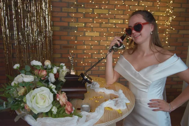 Young bride leaves a message for the groom in the Memoring video guestbook